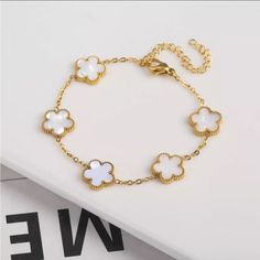 Elegant Gold Plated Stainless Steel Clover Flower Bracelet Stylish Design New Add A Touch Of Elegance To Your Outfit With This Gold Plated Stainless Steel Clover Flower Bracelet. Featuring A Timeless Clover Design, This Durable And Stylish Bracelet Is Perfect For Everyday Wear Or Special Occasions White And Gold 7” + 2” Adjustable Hypoallergenic Nickel Free Smoke Free Home With Next Day Shipping From Sc Keywords Clover Flower Bracelet, Gold Plated Bracelet, Stainless Steel Bracelet, Elegant Brac Minimalist Business Casual, Silver Diamond Bracelet, Clover Jewelry, Clover Design, Bracelet Elegant, Clover Bracelet, Clover Flower, Leaf Bracelet, Bracelets Gold Diamond