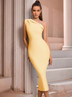 Step into a world of Sophisticated Elegance with our One-Shoulder Form-Fitting Bodycon Bandage Dress. This exquisite piece is the epitome of refined style, designed to accentuate your silhouette with its body-hugging bandage fabric. The one-shoulder design adds a modern, asymmetric twist to the classic bodycon, making it a standout choice for any upscale event. The zip-back feature not only ensures a snug fit but also adds an element of convenience. Whether you're attending a formal dinner, a cocktail party, or a high-profile event, this dress promises to make a statement. Its blend of sophistication and allure makes it a must-have for those who appreciate fashion that's both elegant and bold. Color: Black Style: Elegant Pattern Type: Plain Neckline: Asymmetrical Neck Sleeve Length: Sleeve Elegant Pattern, Formal Dinner, Sophisticated Dress, Ruched Bodycon Dress, Refined Style, Style Elegant, Bandage Dress, Yellow Dress, Cocktail Party