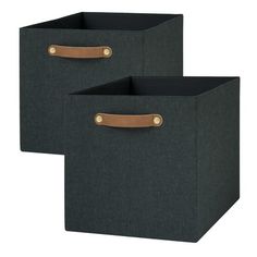 two black storage bins with leather handles