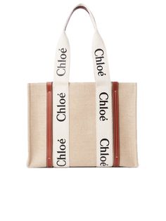 * Medium Woody Tote Bag
   
 * Colour: White/Brown
   
 * Tote bag in linen canvas, calfskin
 * Main material: Linen
 * Secondary material: Calfskin
 * Main lining: Linen
 * Woody ribbon
   
   
 * Carry: Short shoulder & hand
 * 2 long handles
   
 * 1 spacious main compartment
   
   
 * 1 internal flat pocket
   
 * Style ID: CHC22AS383I2690U
   
 * Dustbag & Care card
 * Made in Italy
   
   
   
   
   Measurements
   
   
   
   
    * Width: 37cm x Height: 26cm x Depth: 12cm
      
    * Strap drop: 25cm
      

   
   
   
   
   
   Chloé Woody Women's Tote Bag in Brown Linen
   
   
   Woody, Tote Bag, Brown, White, Linen, Calfskin, Medium, Female. Sunglasses For Your Face Shape, Current Wishlist, Sac Tote Bag, Nyc Winter, Chloe Logo, Chloe Shoulder Bag, Sacs Design, Dream Bags, Brown Tote Bag