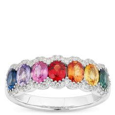 A beautiful rainbow of sapphires for a celebration of love and beauty. Seven stunning oval cut sapphires each showcase their deep natural color and beauty. Each stone is complimented with sparkling round cut diamonds and 14K white gold making this incredible ring a perfect choice to brighten every day or dazzle during the most special events. Multicolor Sapphire Multi-stone Ring, Multicolor Multi-stone Sapphire Ring, Multicolor Sapphire Ring In Fine Jewelry Style, Multicolor Oval Gemstones For Anniversary, Oval Multicolor Gemstones For Anniversary, Fine Jewelry Multicolor Oval Gemstones, Multicolor Sapphire Gemstone Ring, Multicolor Sapphire Ring With Diamond Accents, Multicolor Sapphire Ring With Brilliant Cut