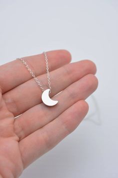 This lovely necklace makes a beautiful, lasting gift. I make this using 925 sterling silver chain and spring clasp. The crescent moon charm is a metal alloy with shiny silver finish and measures approximately 1/2 inch tall. It moves freely along the chain. Comes in a gift box, perfect for gift-giving. This piece looks great when paired with a star necklace. See 5th photo for both necklaces together. Listing is for moon necklace only but star necklace can be purchased here:www.etsy.com/listing/24 Silver Moon Necklace, Moon Necklace Silver, Dainty Choker, Sparkly Jewelry, Long Drop Earrings, Silver Moon, Moon Charm, Lovely Necklace, 925 Sterling Silver Chain