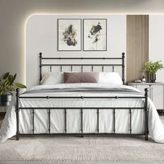 a bed with white sheets and pillows in a room next to two planters on the wall