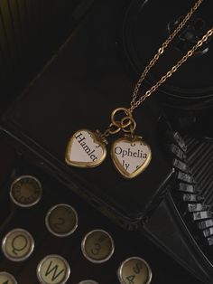 "* This necklace has two small brass lockets that are heart shaped. On each one is a piece of vintage paper that together read, \"Hamlet\" and \"Ophelia\". * No coating over the paper, so do not get wet.  * Gold tone chain.  * Ideal for a Shakespeare lover.  Hamlet & Ophelia locket necklace, Two heart locket necklace, Shakespeare locket, vintage paper locket, dark academia gift Want to see the rest of my shop? www.classicallyromantic.etsy.com" Hamlet Ophelia, Hamlet And Ophelia, Locket Vintage, Vintage Locket, Heart Locket Necklace, Two Hearts, Heart Locket, Locket Necklace, Bridesmaid Jewelry