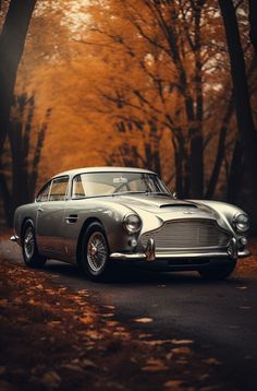 an old fashioned car parked on the side of a road in front of some trees