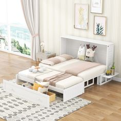 a white bed sitting on top of a wooden floor