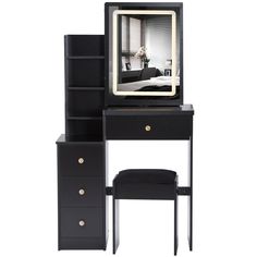 a black desk with a mirror on top of it next to a chair and ottoman