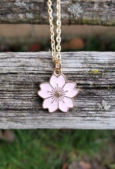 This cute little Sakura flower (cherry blossom) necklace would make a great gift. You can choose between 5 colors: pink, red, white, turquoise, and black. The flower measures 5/8 inch wide. You can choose the length and color of your necklace at checkout. This would make a great gift for a bridesmaid or a birthday, an anniversary or Christmas. All jewelry items come in a gift box. Pink Flower Charm Necklace With Flower Pendant, Pink Flower Charm Necklace Gift, Pink Flower Charm Necklaces For Gift, Pink Flower Charm Necklaces As Gift, Cute Flower Pendant Jewelry For Gifts, Cute Flower Pendant Jewelry Gift, Pink Flower Charm Necklace, Charming Pink Necklace For Gift, Cute Rose Gold Necklace For Gift