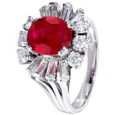 This one-of-a-kind white gold ring brings together an inviting cabochon ruby and round brilliant white diamonds in a design that’s both intricate and graceful. The centre stone, specially selected from the Haruni vault, is a bright red oval ruby, whose natural beauty is emphasised by the 12 sparkling diamonds arranged around it. Ring Size: UK - L, US - 5 3/4 3.04 Carat Ruby Luxury Oval Ruby Diamond Ring, Luxury Ruby And Diamond Oval Cabochon Ring, Luxury Ruby Ring With Diamond Accents And Round Shape, Luxury Ruby Ring With Oval Cabochon Diamond, Luxury Round Ruby Ring With Diamond Accents, Luxury Ruby Gemstone Ring In Platinum, Oval Cabochon Ruby And Diamond Ring, Oval Cabochon Ruby Ring With Diamonds, Luxury Ruby Ring With Platinum Center Stone