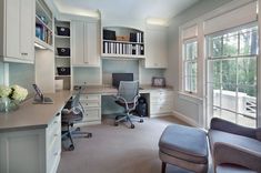 an office with two chairs and a desk