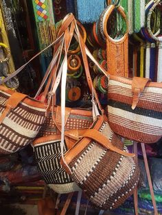 "Sisal bag,leather bag,African bag,sling bag,African purse,crossbody bag, These bags were traditionally used by women for carrying food from the garden. It is handwoven by Kikuyu and kamba women. This bag can be for everyday use . Material: leather ,sisal and  wool. It's 13\" wide ×10 tall. Ship via dhl express. Thank you for visiting." African Bag, Woven Leather Bag, African Accessories, Unique Mothers Day Gifts, Handcrafted Bags, Woven Tote Bag, Grandmother Gifts, Boho Stil, Woven Bag