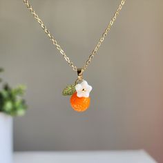 Can't find your perfect fit length? Do have material requirements? We offer custom orange fruit necklace. Your satisfaction is our priority. How to customize? You choose the design; we hand make the necklace for you. Elevate your style with this exquisite orange flower pendant necklace. The pendant is delicately crafted with intricate details, capturing the beauty of nature in its design. You offer various colors of orange. Lightweight and comfortable to wear, it's the perfect accessory to compl Orange Pendant Charm Necklaces For Gifts, Orange Charm Jewelry For Gifts, Handmade Orange Charm Necklace As A Gift, Handmade Orange Charm Necklace For Gift, Orange Necklace With Adjustable Chain For Gift, Orange Necklace With Adjustable Chain As Gift, Orange Flower Pendant Jewelry Gift, Orange Flower Pendant Jewelry For Gift, Orange Jewelry With Fruit Design For Gifts