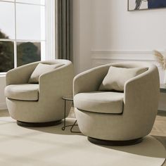 two chairs sitting next to each other in front of a window on top of a rug