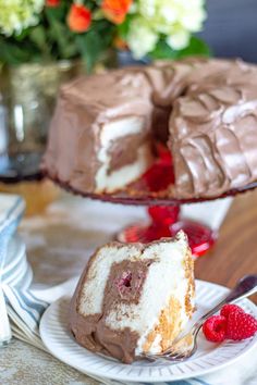 a piece of cake on a plate with a fork next to it and another slice missing