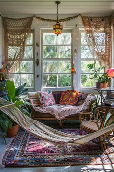 a living room filled with lots of furniture and plants on top of windowsills