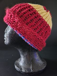 a knitted hat on top of a mannequin head