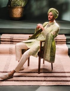 Step into refined elegance with the Pista Barfi sherwani, a soothing sage green ensemble ideal for daytime celebrations. Adorned with intricate zardozi and dabka embroidery, this sherwani features a medley of signature motifs, complemented by contrasting trousers and kurta. A perfect balance of tradition and sophistication, reminiscent of its namesake sweet. It comes with an optional dupatta. Green Kurta With Naqshi In Traditional Drape, Green Kurta With Naqshi And Traditional Drape, Pista Green Kurta With Resham Embroidery, Green Raw Silk Straight Kurta Bandhgala, Traditional Drape Kurta In Pista Green For Transitional Season, Green Bollywood Bandhgala With Chikankari Embroidery, Pista Green Traditional Drape Kurta For Transitional Season, Festive Pista Green Straight Kurta Bandhgala, Pista Green Kurta With Naqshi Traditional Drape