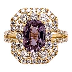 This unique ring has a very unusual center stone. It is a GIA certified, unheated natural purple sapphire that weighs 2.06 carats. The soft purple hue is complemented by the 1.58 carats of round brilliant diamonds and set in the 18k yellow gold. This delightful combination is an eye pleaser! Ring Size: 6.5 & can be sized One of a kind, cannot be reproduced. Purple Sapphire Ring, Purple Stone Rings, Purple Ring, Purple Rings, Purple Diamond, Gold Solitaire Ring, Purple Sapphire, Platinum Engagement Rings, Sapphire Diamond Ring