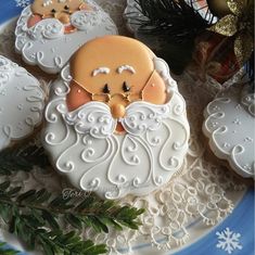 cookies decorated with icing and decorations on a plate