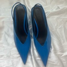 Never Worn! Blue Slingback Heels With 4-inch Heel, Blue Ankle Strap Slingback Pumps With 4-inch Heel, Blue Slingback Pumps With 4-inch Heel For Evening, Blue Synthetic Slingback Sandals, Blue Round Toe Slingback Pumps For Evening, Blue Slingback Pumps With Round Toe For Evening, Blue Slingback Pumps For Spring, Blue Slingback Pumps With Open Heel For Spring, Chic Blue Pointed Toe Slingback Pumps