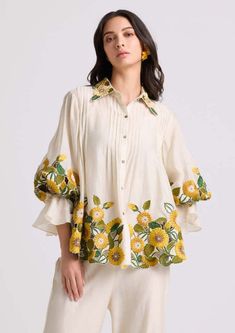 Ivory Sunflower Shirt by Chandrima available on Indiaspopup.com Trendy Printed Blouse, Blouses For Women Trendy, Trendy Tops For Women Blouses, Pleated Top Design, Elegant Embroidered Yellow Top, Elegant Yellow Embroidered Top, Shirt Style Kurti Designs, Tunics For Women Classy Casual, Tunic Shirt Outfit