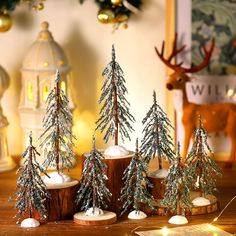 small christmas trees are sitting on a table