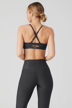 Here’s why the Intrigue Bra will be your new go-to: It’s made from our signature Airlift fabric for a supportive, snug fit that’s ready for everything from HIIT to headstands. The cut is simple but flattering, designed with a scoop-neck, adjustable straps that crisscross in back for extra lift, and a keyhole cutout. Wear it with sweats to cozy up at home, with matching Airlift leggings to make a cute set… Really, when won’t you reach for it? Workout Outfits, Tank Top Bras, Womens Capris, Back Women, Alo Yoga, Bra Women, Hat Hairstyles, Long Sleeve Crop Top, Bra Tops