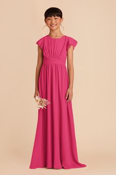 This sweet ruffle-sleeved dress in Fuchsia is a dream for a junior bridesmaid. Featuring a waistband tie in back for juniors who are between sizes. Perfect for a younger junior bridesmaid or an older flower girl, this frilly-sleeved look is cute as a button. And the hidden side pockets are perfect for stashing her favorite lip balm, instructions for how to save the world, etc.n | Fuchsia Bridesmaid Dress Chiffon Size XL | Birdy Grey Celine Junior Fuchsia Bridesmaid Dresses, Bridesmaid Dress Chiffon, Junior Dress, Birdy Grey, Cute As A Button, Dress Chiffon, The Wedding Date, Floor Length Skirt, Save The World