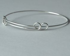 Sterling silver expandable bangle SIZE: width: 2.5 inch to 3.25 inch You will receive one sterling silver expandable bracelet. It's .925 sterling silver. Please contact me if you need a different quantity. Thanks for looking! Adjustable Sterling Silver Bracelet For Friendship, Adjustable Sterling Silver Round Bangle, Silver Nickel-free Bangle For Friendship, Silver Sliding Knot Bangle Bracelets, Silver Sliding Knot Bangle Bracelet, Silver Adjustable Band Bracelet As Gift, Silver Adjustable Band Bracelet For Gift, Silver Bangle Bracelet With Sliding Knot, Silver Hypoallergenic Bangle As Gift