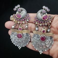 These Jhumka Earrings set have an excellent finish and gives out an exquisite sense of style. If you are looking for an amazing Fashion Jewelry set for special occasions such as Anniversary, Engagement, Party, Wedding or for gifting , then your search ends here. Handmade Indian Temple Jewelry, best to wear it for traditional ceremonies or Indian wedding. This bridal jewelry has ethnic finish. It has Cubic Zircon stones with ruby and emeralds. It is a Bollywood style one gram jewelry. There are l Festive Peacock Design Drop Earrings, Festive Peacock Design Drop Danglers, Fusion Style Peacock Design Earrings For Wedding, Elegant Oxidized Finish Earrings For Festive Occasions, Fusion Style Wedding Earrings With Peacock Design, Elegant Oxidized Finish Festive Earrings, Fusion Wedding Earrings With Peacock Design, Elegant Festive Earrings With Oxidized Finish, Temple Jewelry Earrings With Peacock Design For Diwali