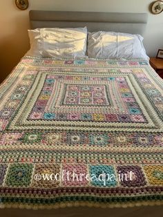 a crocheted bedspread made to look like a quilt