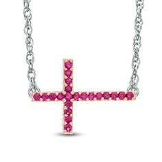 A sleek choice, this cross necklace expresses your beliefs in modern style. Crafted in sterling silver, this design features a cross set on its side and lined with lab-created bright red rubies. Buffed to a brilliant luster, this look suspends centered along an 18.0-inch rope chain that secures with a spring-ring clasp. Sideways Cross Necklace, Cross Necklace Sideways, Sterling Silver Cross Necklace, July Birthday, Peoples Jewellers, Cross Ring, Ruby Stone, Red Stone, Rope Chain