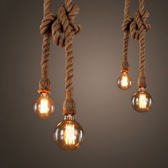 three light bulbs hanging from a rope