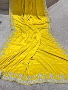 zarkan heavy hand crafted pure crepe silk saree in yellow. It is an exclusive heavy wedding party wear saree. comes with pre stitched blouse Yellow Silk Sharara With Dabka Work, Yellow Silk Pre-draped Saree With Pallu, Elegant Yellow Silk Sharara, Yellow Dola Silk Pre-draped Saree For Navratri, Yellow Silk Traditional Wear With Dabka Work, Yellow Chinon Pre-draped Saree, Yellow Katan Silk Pre-draped Saree, Silk Yellow Blouse Piece With Cutdana, Yellow Semi-stitched Pre-draped Saree For Festivals