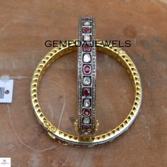 Polki Diamond Silver Bangle, Red Ruby Gemstone Bangle, 925 Sterling Silver Jewelry, Openable Bangle Bracelet, Wedding Gift, Gift For her Gross Weight: 29.59 gram Gemstone Weight: 8.91 cts Polki Diamond Weight: 1.52 cts Pave Diamond Weight: 2.44 cts Bangle Size: 63X63 MM NOTE:- All The Products Are Designed And Manufactured In My Workshop By Me & My Team. Shown Products Are Purely Handmade. Custom Orders Are Open Handly Accepted. We Are Perfect Choice For Any Custom Jewelry Manufacturing. For Luxury Stackable Ruby Jewelry, Classic Wedding Bangle Hallmarked, Red Diamond Bracelets Fine Jewelry, Red Diamond Fine Jewelry Bracelet, Sterling Silver Cuff Bracelet With Gemstone For Wedding, Adjustable Ruby Bracelets For Formal Occasions, Formal Adjustable Ruby Bracelets, Adjustable Ruby Bracelet For Formal Occasions, Elegant Multi-stone Bangle For Anniversary