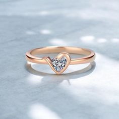 Celebrate love and elegance with our 2024 New Heart Moissanite Ring, a true testament to timeless beauty and exquisite craftsmanship. Meticulously designed, this stunning ring features a dazzling heart-shaped moissanite gem, set in real rose gold for an elegant and romantic touch. The band, crafted from 925 sterling silver, ensures durability and a luxurious feel, making it the perfect piece for everyday wear or special occasions. Whether you're celebrating an anniversary or just want to show yo Moissanite Heart Cut Diamond Ring For Proposal, Heart Cut Moissanite Diamond Ring For Proposal, Rose Gold Solitaire Ring For Valentine's Day, Rose Gold Diamond Heart Ring For Proposal, Heart Cut Moissanite Diamond Ring For Anniversary, Rose Gold Cubic Zirconia Heart Ring For Promise, Moissanite Round Cut Diamond Ring For Valentine's Day, Rose Gold Solitaire Heart Ring For Promise, Rose Gold Heart Ring With Brilliant Cut For Promise