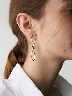 Editor's Notes The basic details express a modern classic mood it can be styled with any outfit for natural daily look.- Modern chic curved earring (single)- Can create a style that you want- Hand-made item- 925silver and 14&18k gold plated- Daily point itemMeasurements(in.)ONE SIZE- Length 2.4in.*0.4in.Composition & Care- 92.5 silver plated 18k gold- Keep it in a pouch- Keep it from moistureDesigner- by HYEON.K Modern Wrap Earrings With Ear Wire, Modern Everyday Elegance Earrings, Modern Twist Earrings For Everyday Wear, Classic Wrap Earrings With Ear Wire, Chic Silver Wrap Earrings, Chic Sterling Silver Hoop Earrings, Chic Silver Linear Earrings For Formal Occasions, Chic Pierced Linear Earrings For Formal Occasions, Modern Twist Sterling Silver Wrap Earrings