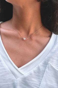 Dainty and minimal, pearl necklace. Designed with the skinniest chain that creates a modern and simple statement. This single necklace is tarnish free and meant to last with the proper love and care. Gold dipped chain and shiny, rounded, pearl. Minimalist White Pearl Necklace For Everyday Wear, Minimalist White Chain Necklace With Pearl Pendant, Minimalist White Pearl Necklace For Everyday, Simple Pearl Necklace As Gift, Minimalist White Pearl Necklace With Charm, Minimalist White Chain Necklace For Everyday, Minimalist White Chain Choker Necklace, Minimalist White Choker Chain Necklace, Minimalist White Beaded Pearl Necklace