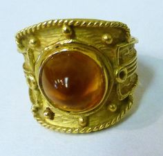 18kt yellow gold ring with a high cabochon citrine. Stone measures 9mm x 18mm and ring weighs 6.1 dwt (9.4 grams) Fits ring size 6-3/4 Pre owned age appropriate condition. Cabochon Ring, Large Crystals, Multi Stone, Multi Stone Ring, Yellow Gold Rings, Stone Rings, Citrine, Charm Pendant, Class Ring