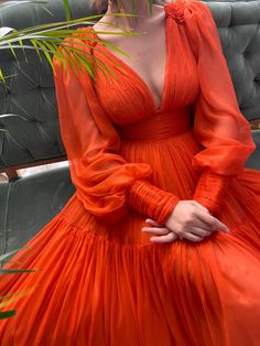 Details:-Designer silk fabric-Vivid orange color-A-line style with deep cleavage cusp and see through sleeves-For special occasions Prom Dress Long Sleeve, Cheap Evening Gowns, Orange Chiffon, Prom Dress Long, Drape Gowns, Drape Maxi Dress, A Line Evening Dress, Floor Length Prom Dresses, Long Sleeve Prom