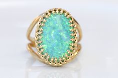 GREEN OPAL RING, Opal Gold Ring, Gemstone ring, October Birthstone, Opal Emerald lawn Gold Filled Ring, Fire Opal jewelry, Opal Big Ring Statement green opal ring made of 14k gold filled the stone is 13*18 mm , it is a perfect to give as a gift for woman Measurements: Size- available all size The center stone is 18mmx13mm Gemstone is a lab opal The ring will be packed in a gift box. FOR MY RINGS COLLECTION HERE: https://www.etsy.com/il-en/shop/rebekajewelry?section_id=14282915&ref=shopsectio Green Oval Stone Setting Rings, Green Oval Rings With Stone Setting, Oval Green Rings With Stone Setting, Elegant Green Opal Oval Ring, Green Oval Opal Ring For Formal Occasions, Green Cabochon Ring Jewelry, Unique Green Jewelry With Accent Stones, Unique Green Emerald Ring With Stone Setting, Green Emerald Ring With Stone Setting