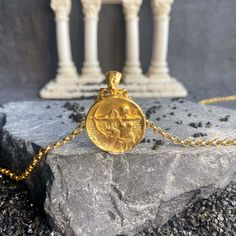 Gold filled Artemis necklace is very meaningful. She is the Olympian goddess of wild animals and nature in Greek mytholog. She was identified by the Romans with Diana. Your minimal gold filled Artemis charm pendant looks very attractive and eye catching with details. Artemis coin medallion will establish emotional connection with you and give you inspiration to find your inner goddess. Artemis Diana necklace made with 925 carat silver and 22 carat gold filled on silver. special greek pendant gif Mythological Style Round Jewelry Gift, Gold Pendant Jewelry In Vintage Style, Gold Antique Pendant Jewelry, Mythological Style Yellow Gold Jewelry As Gift, Mythological Style Yellow Gold Jewelry Gift, Ancient Style Round Pendant Necklace For Gift, Mythological Round Pendant Jewelry As Gift, Ancient Style Engraved Yellow Gold Necklaces, Mythological Medallion Jewelry Gift