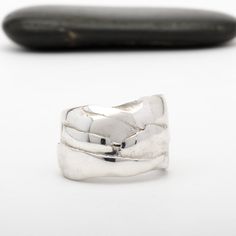 This "Odin" silver ring is handmade in Fine Silver (99.9% pure silver). This unique piece is entirely molded by hand, using the silver clay technique. The style of this ring is inspired by the Vikings and the Old Norse mythology. Ring size: 7.5 (This is a unique creation. Only one size available. I cannot adjust the ring size.) What is Fine Silver? Fine Silver, also called Precious Metal Clay or Silver Clay, is a malleable material composed of microscopic particles of pure silver. It is made fro Hand Forged Wide Band Sterling Silver Ring, Silver Hand Forged Wide Band Open Ring, Hand Forged Silver Ring With Thick Band, Unique Hand Forged Sterling Silver Wide Band Ring, Silver Hand-forged Wide Band Ring For Anniversary, Unique Hand Cast Sterling Silver Engraved Ring, Hand Forged Sterling Silver Rings With Thick Band, Unique Sterling Silver Rings With Thick Band, Unique Engraved Wide Band Ring In Sterling Silver