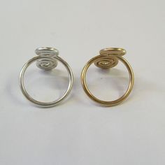 This listing is for a set of TWO fun and flirty, scrolled-wire toe rings in plain round wire--one 14kt gold filled and one sterling silver. Smooth and comfortable! They are fully adjustable, open on the top to allow them to expand over the round ball of your toe and then squeeze down to fit snugly. Wear one on each foot, or keep one and give the other to a friend! Also available in both gold or both silver. Adjustable Jewelry, Toe Ring, Rings Set, Toe Rings, 14kt Gold, Silver Wire, Ring Sets, My Jewellery, Hippie Boho