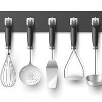 an image of kitchen utensils hanging on the wall