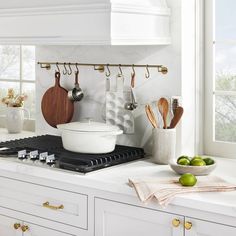 a kitchen counter with pots and pans on it