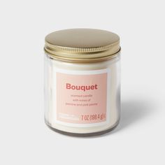 a jar of bouguett candle on a white background