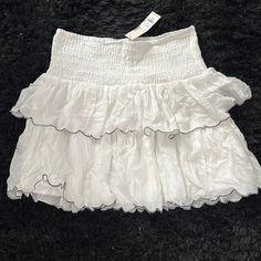 Size Large Never Worn New With Tag White Mini Skort With Ruffle Hem, White Ruffle Hem Mini Skort, White Skort With Ruffle Hem, White Tiered Skort With Ruffles, Chic White Mini Skirt With Ruffle Hem, White Tiered Mini Skirt With Ruffles, White Mini Skirt With Ruffle Hem For Day Out, Chic White Mini Skirt With Ruffles, White Ruffle Hem Mini Skirt For Day Out