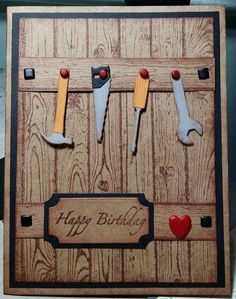 a birthday card with some tools hanging on the pegs to make it look like they have been made out of wood