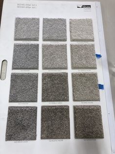 a bunch of carpet samples sitting on top of a table